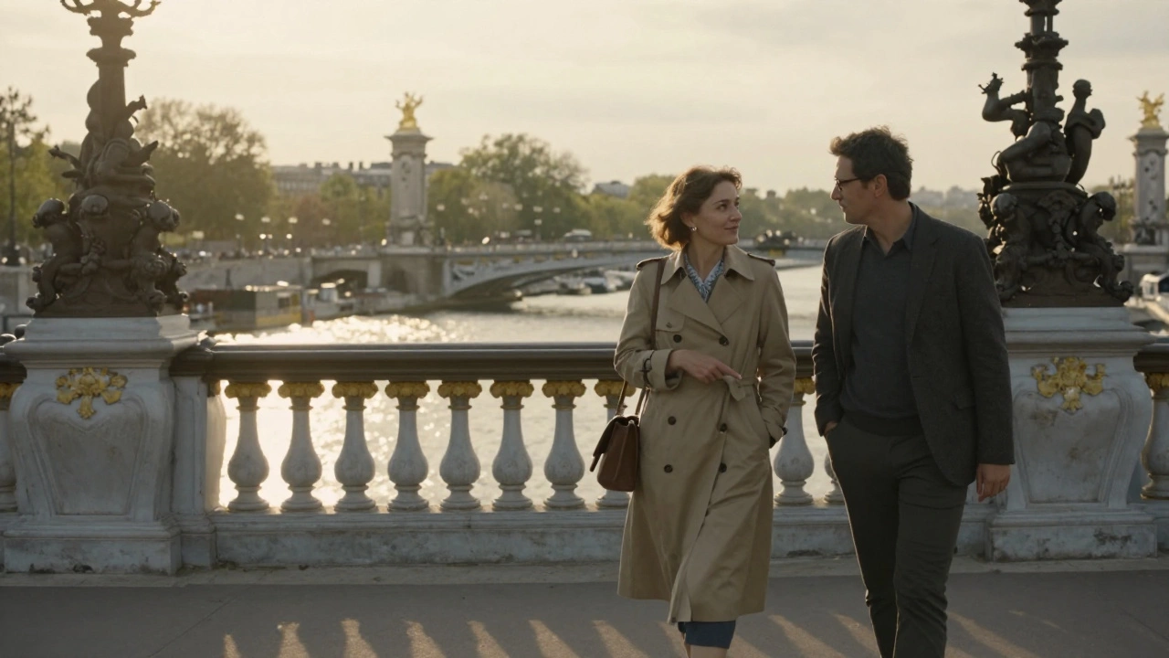A woman and client walking together on Pont Alexandre III at sunset, pointing to the river below, golden light reflecting on water.